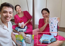 To Dinh Khanh and his pregnant wife show off a series of new gifts for the baby, revealing the sex of the first child