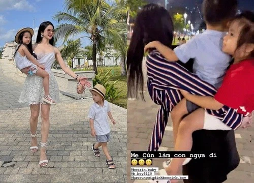 Diệp Lâm Anh cõng 2 con trên lưng, nhìn xuống đôi giày cao gót mà choáng!