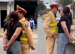 Identity of the handcuffed woman who "snarled" and asked to kiss the traffic police officer: Police spoke up