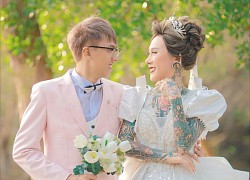 The full tattooed LGBT bride despite her disapproving eyes is still happy with her marriage