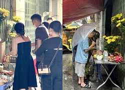 Choking on images of rain-clad Hanoians laying flowers to commemorate 56 victims of the mini-apartment fire