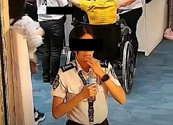 Close-up of female airport employee "swallowing" $300 from a passenger, an unexpected way to destroy evidence