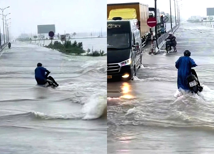 Khoảnh khắc đoàn xe tải làm 'lá chắn' giúp người đi xe máy vượt lũ gây xúc động