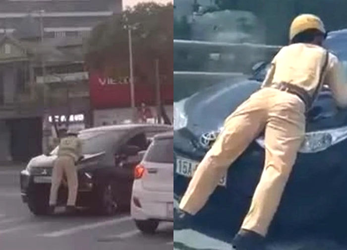Ô tô lao nhanh khi một cảnh sát giao thông bám trên nắp capo