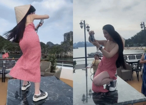 Quang Hai's wife was said to be rude for wearing shoes on the dinner table to take photos for her husband's house