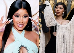Cardi B stuns Paris with fringe dress and creepy "living accessories"!