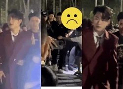Duong Domic caused controversy because of his indifferent attitude when watching a fan being pushed down by bodyguards?