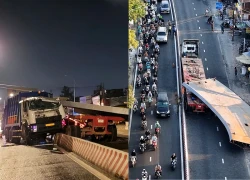 A 10-ton steel beam fell and crushed a garbage truck, killing the driver and paralyzing traffic on Nguyen Huu Tho street.