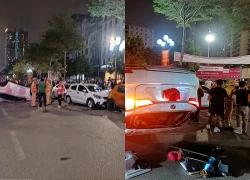 Horrific collision in Trung Kinh: Car overturned, motorbike completely wrecked, chaotic scene.