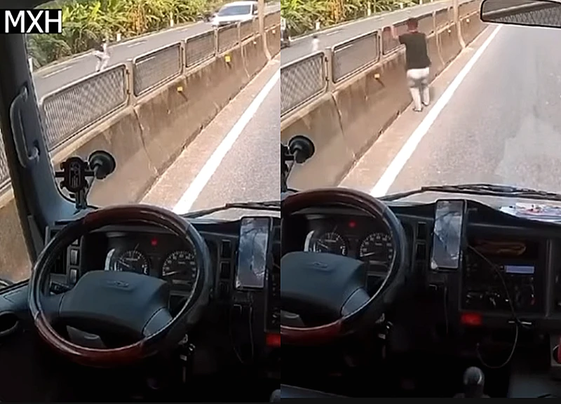 Clip: Tài xế bỏ xe, lao qua dải phân cách ôm chặt bé nhỏ giữa dòng xe container